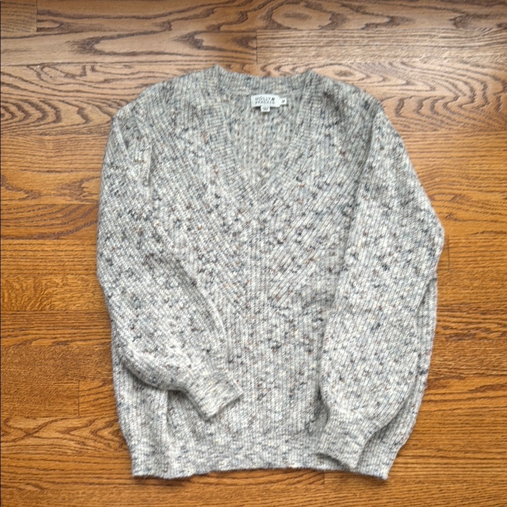 Gray women’s sweater with v neck detail